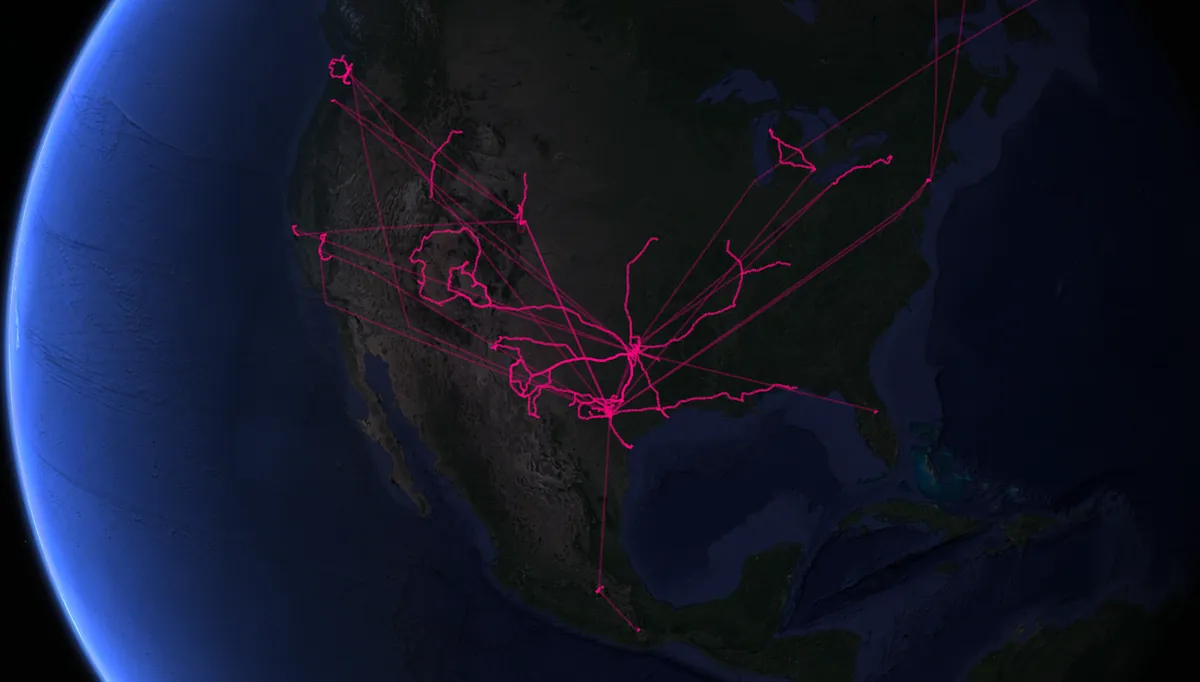 Animated map of North America showing glowing pink paths connecting cities, visualizing life trajectories.