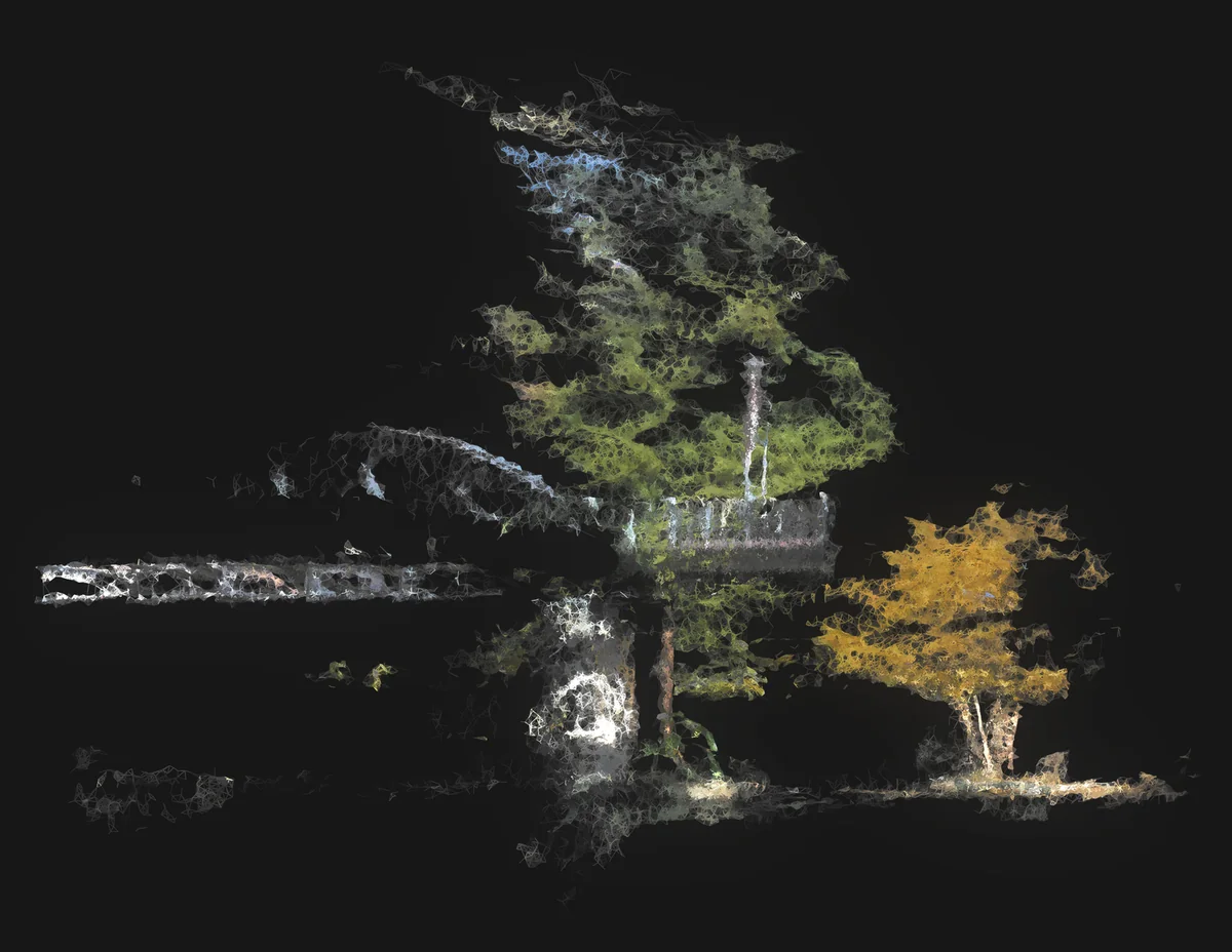 Photogrammetry mesh of a tree and bridge, rendered with glowing, fragmented edges and autumnal color.