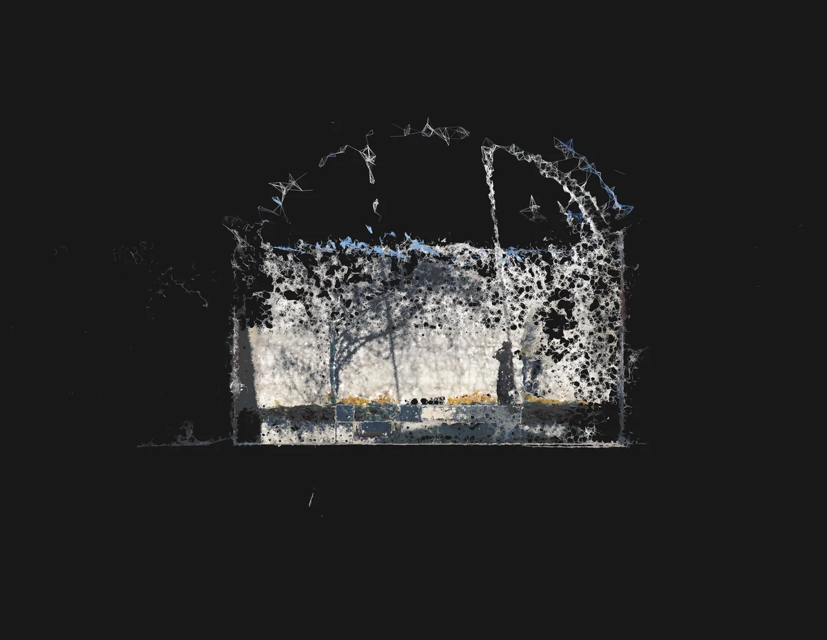 Photogrammetry mesh of a fragmented architectural facade with glowing edges and textured surfaces against a dark background.