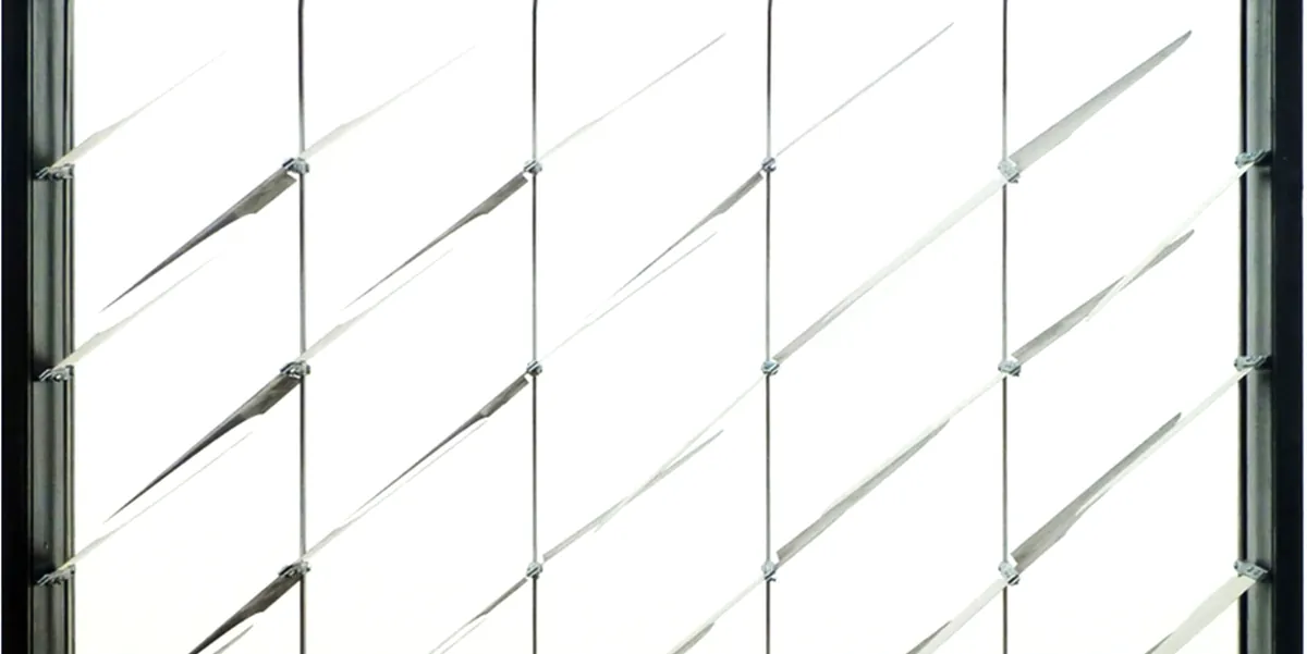 Diagonal bimetal fins pivot with heat to track sun, adjusting transparency and heat gain without moving parts.